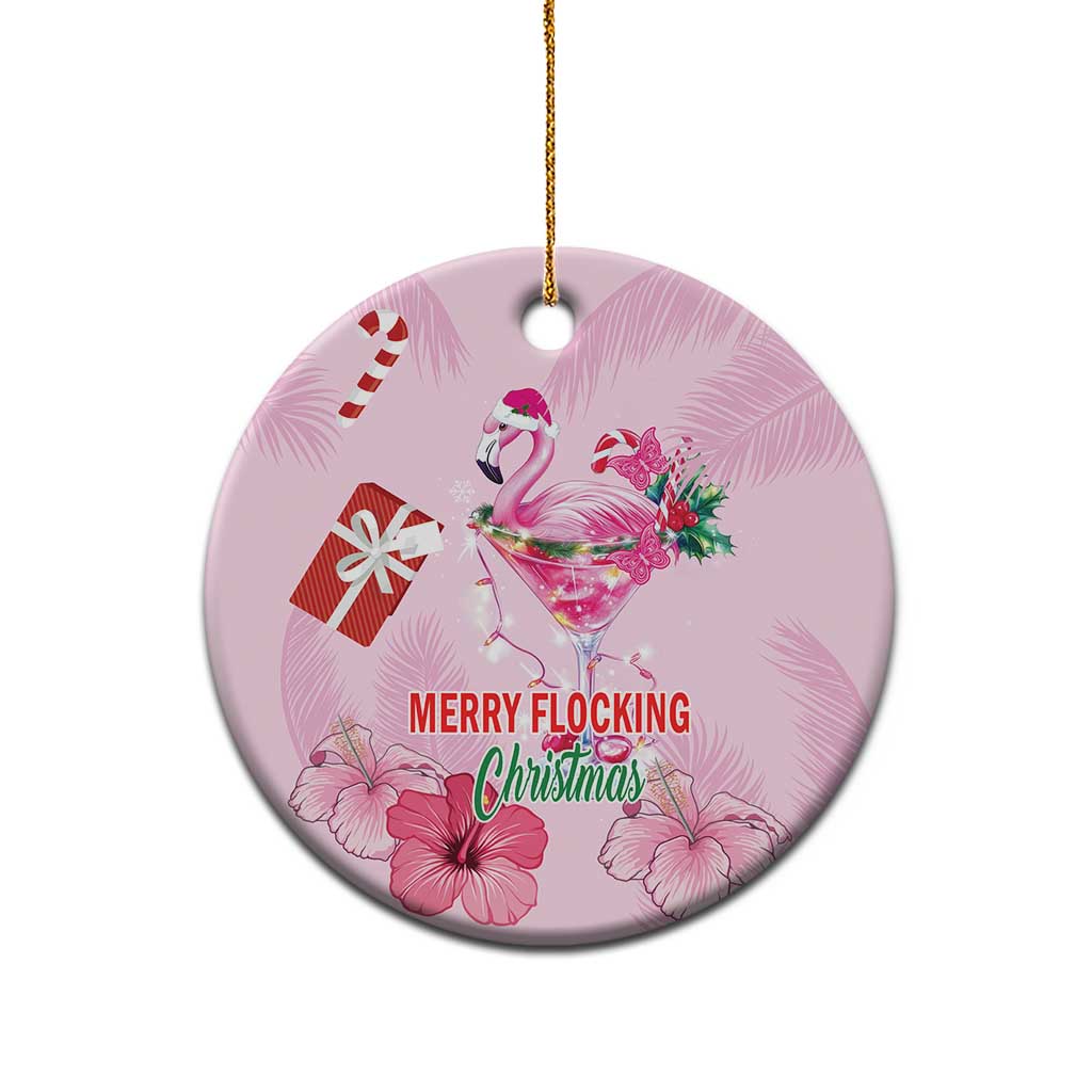 Pink round flamingo Christmas ceramic ornament with gold hanging loop; “MERRY FLOCKING” text.