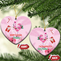 Pink flamingo Christmas ceramic heart ornament with gold loop; “MERRY FLOCKING Christmas”.