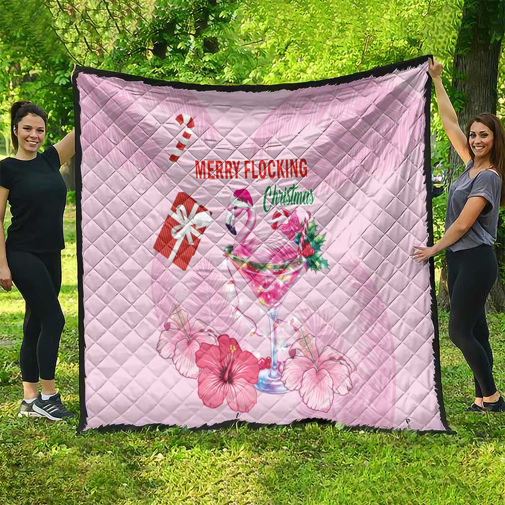 Pink quilt spread out outdoors, diamond quilting with flamingo, gifts, and Merry Flocking