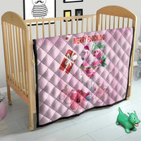 Pink quilt on a wooden crib, diamond quilting with flamingo and Merry Flocking graphics