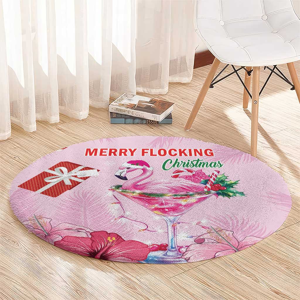 Pink round Christmas carpet with flamingo martini glass, holly and ribbon, 'MERRY FLOCKING' text