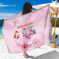 Pink sarong with flamingo, hibiscus, and 'Merry Flocking Christmas' text print