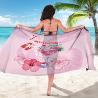 Pink sarong featuring flamingo cocktail and 'Merry Flocking Christmas' graphic