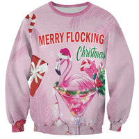 Pink unisex sweatshirt with flamingo “Merry Flocking Christmas” graphic