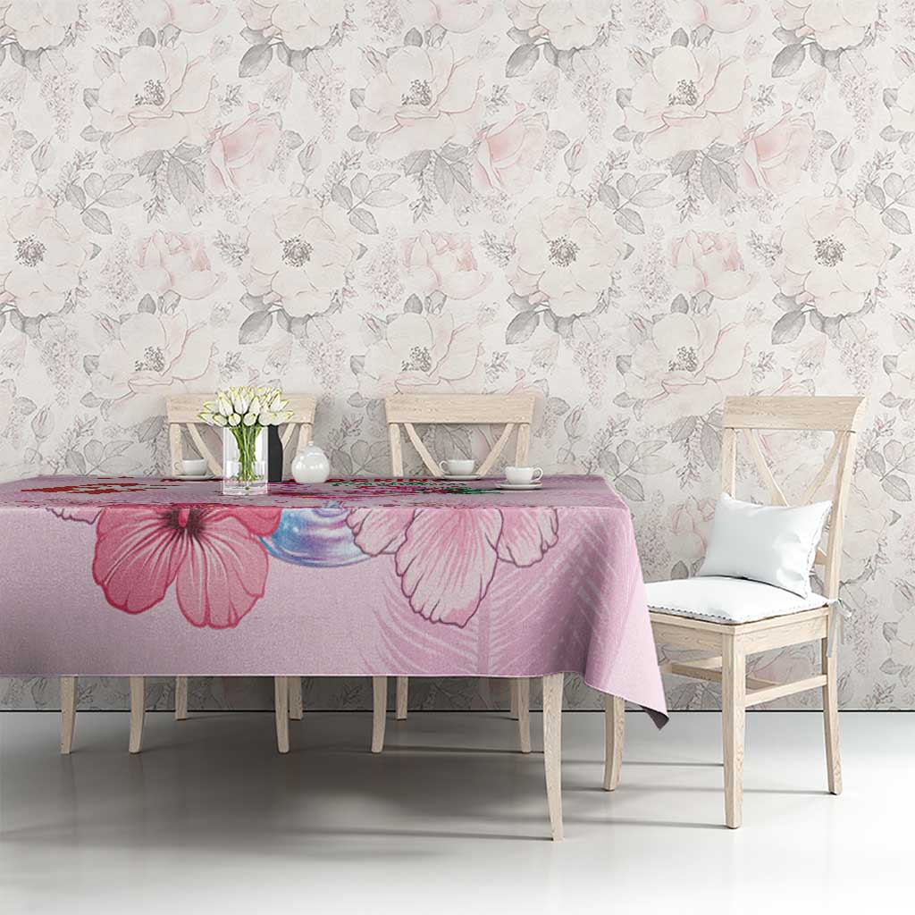 Pink Christmas tablecloth with large pink flower print on dining table