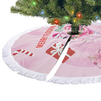 Pink Christmas tree skirt with flamingo martini artwork and white fringed trim