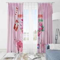 Pink Christmas window curtains with flamingo and holiday flower print, hanging on rod rings