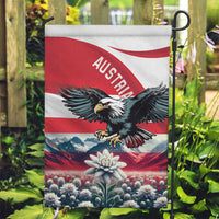 Austria garden flag on a stake with black eagle emblem and central edelweiss flower