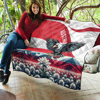 Red, white, and blue quilt blanket with black eagle and Edelweiss over flower meadow
