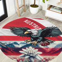 Round red and blue eagle carpet with AUSTRIA text stripe and edelweiss flower center