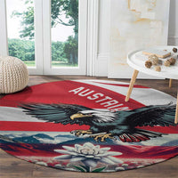 Round red, white, and blue carpet with AUSTRIA lettering, eagle crest, mountains and edelweiss