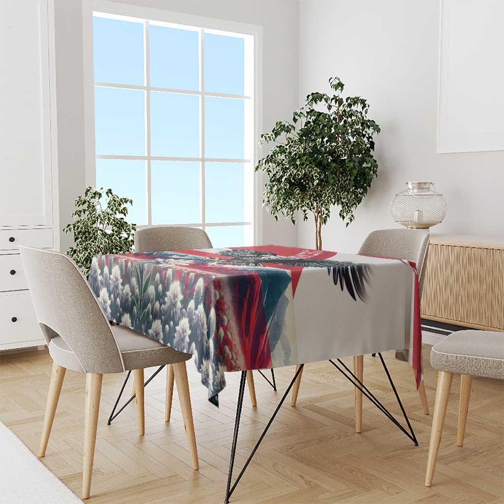 Black and blue floral tablecloth with red stripe border on a rectangular dining table