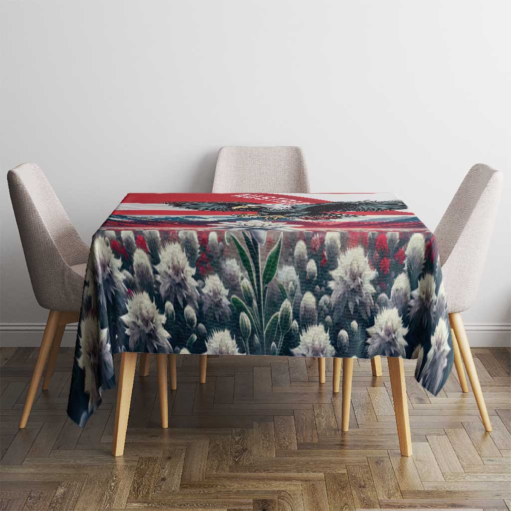 Blue-black floral tablecloth with red border stripe over a square dining table