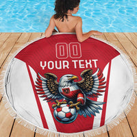 Round beach blanket with red center, white sides, eagle mascot and soccer ball print