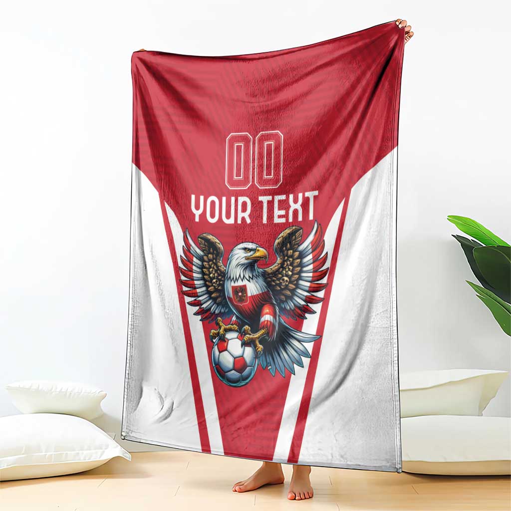 Red and white football blanket hanging like a cape, eagle mascot and soccer ball with 'YOUR TEXT'.