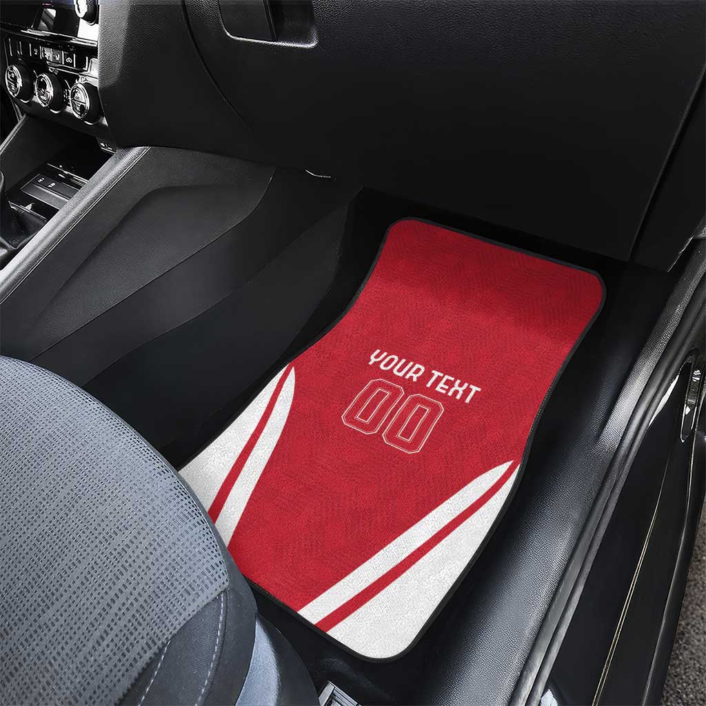 Red car floor mat on passenger side with white diagonal stripes and “YOUR TEXT 00”