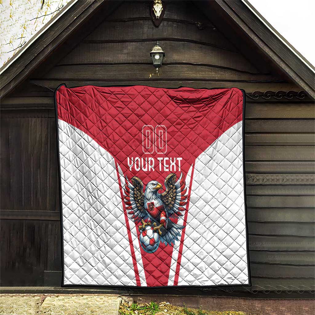 Red and white quilt hanging on wall with eagle mascot and “Your Text”