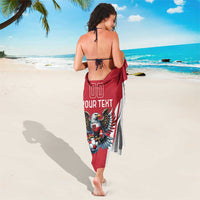 Red and white football team sarong with eagle mascot print, draped behind back