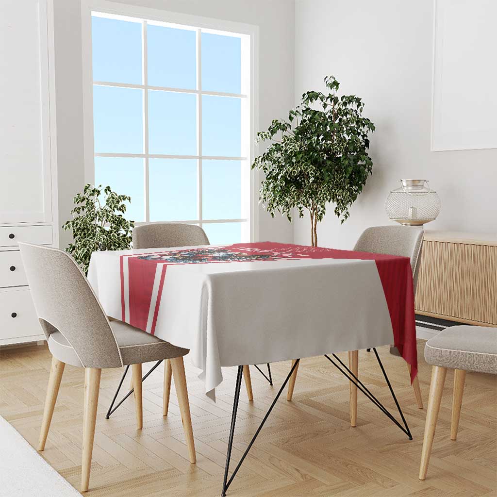 Red and white football tablecloth laid on dining table, eagle mascot center design