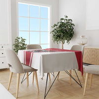 Red and white football tablecloth laid on dining table, eagle mascot center design