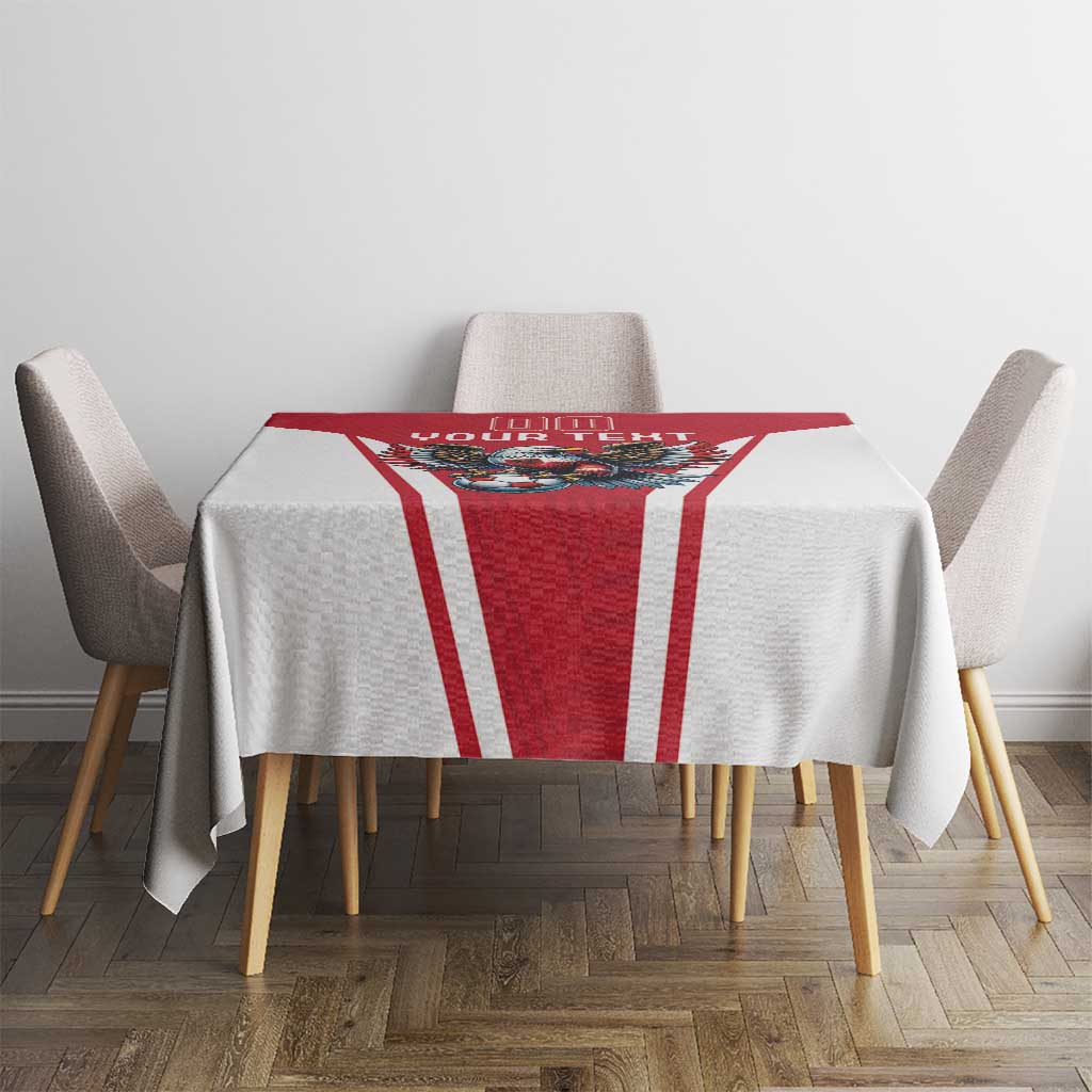 Red and white football tablecloth on dining table with eagle mascot and vertical stripes