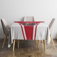 Red and white football tablecloth on dining table with eagle mascot and vertical stripes