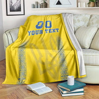 Yellow blanket with blue “00” and “YOUR TEXT” and blue patterned side panels