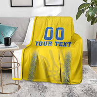 Yellow football-style blanket with blue “00” and “YOUR TEXT” print, patterned border panels