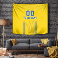 Yellow football tapestry hung on brick wall with blue “00” and “YOUR TEXT” design
