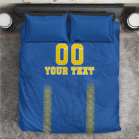 Blue football bedding set with '00' and 'YOUR TEXT' graphic on duvet and pillowcases