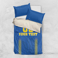 Blue football bedding set with '00' and 'YOUR TEXT' on duvet plus off-white accent panel