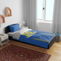 Blue football bedding set showing '00' and 'YOUR TEXT' on duvet with matching blue pillows