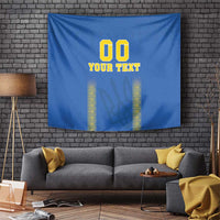 Blue football tapestry with '00 YOUR TEXT' and yellow vertical patterned columns, wall-hung