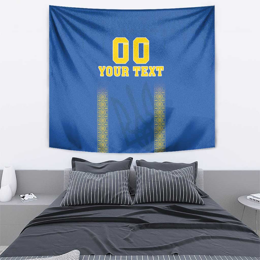 Blue football tapestry with '00 YOUR TEXT' and yellow patterned columns, wall-hung