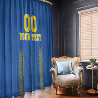 Blue window curtain panel with yellow “00” and “YOUR TEXT” print, hanging over a window.