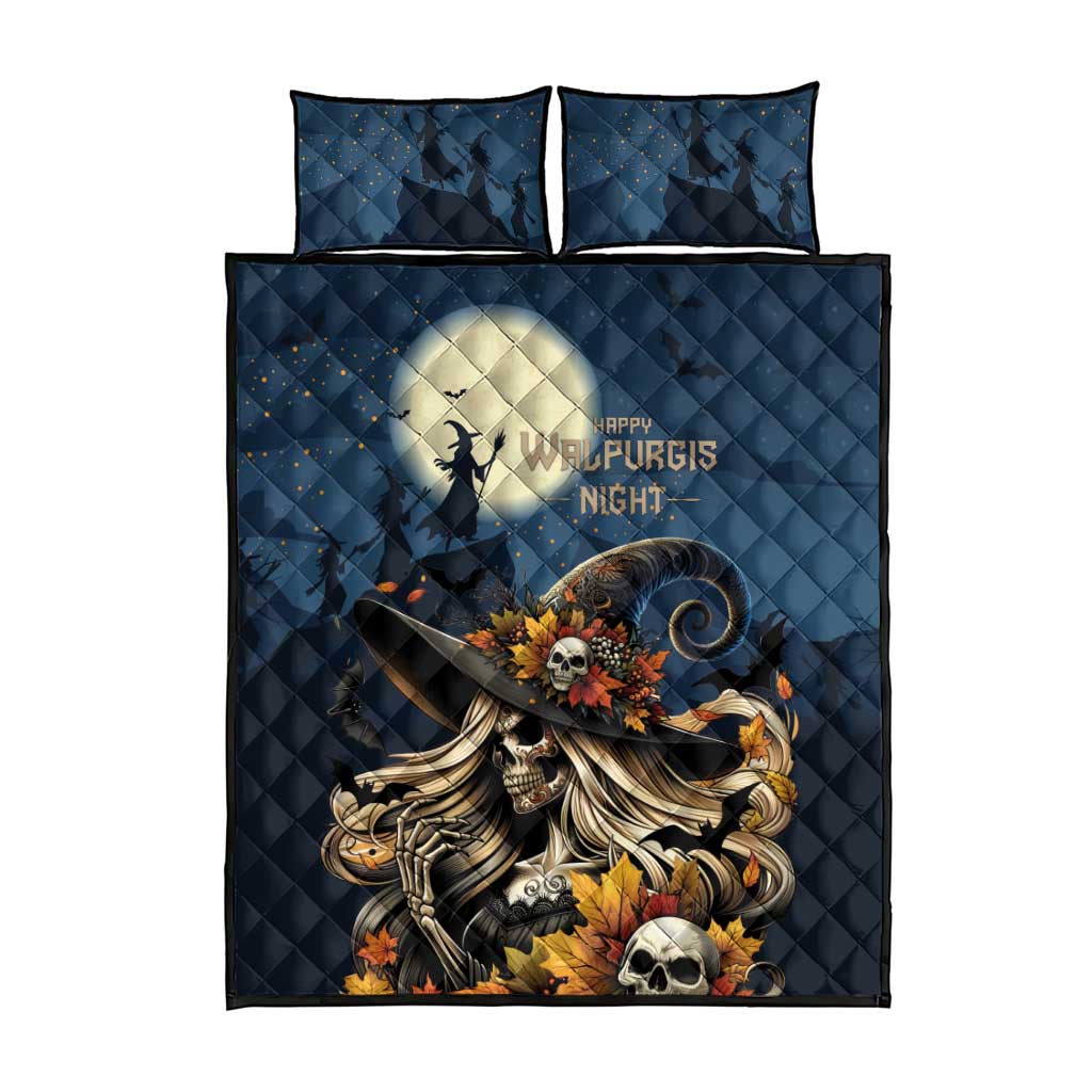 Dark blue quilt bed set with two matching pillows and skull witch centerpiece design