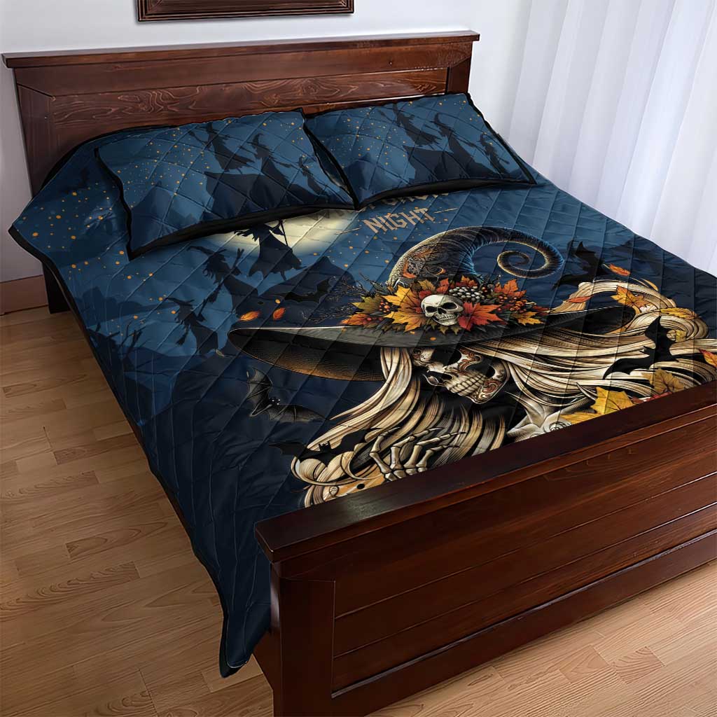 Dark blue quilt bed set with skull witch figure and skeleton hand artwork on quilt