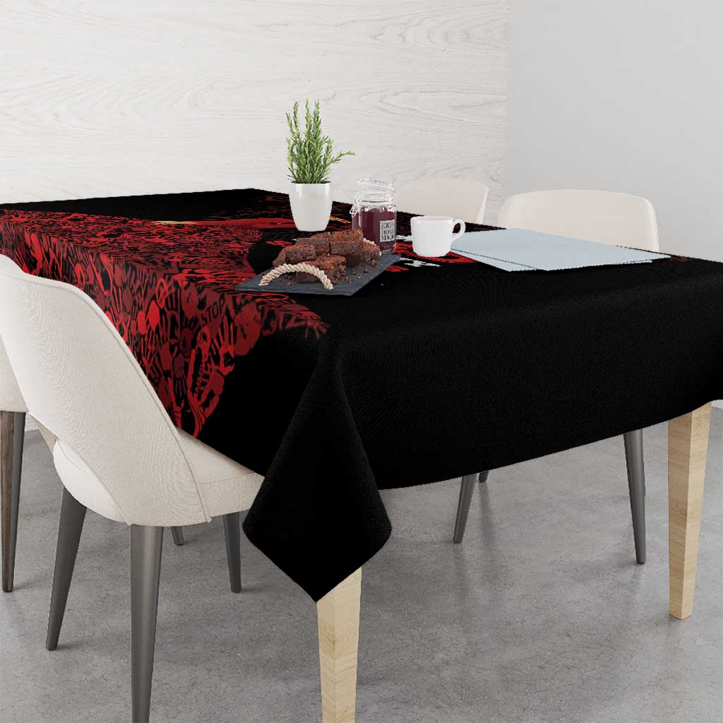Black tablecloth with red abstract pattern along the tabletop edge