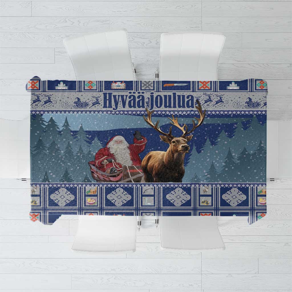 Blue holiday tablecloth with reindeer and snowy village border print.