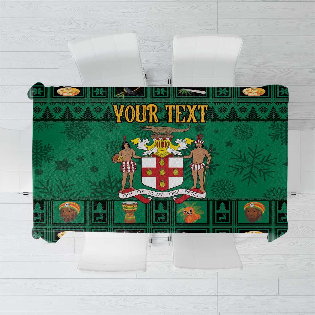 Green Christmas tablecloth with coat of arms crest, festive icons, and border pattern
