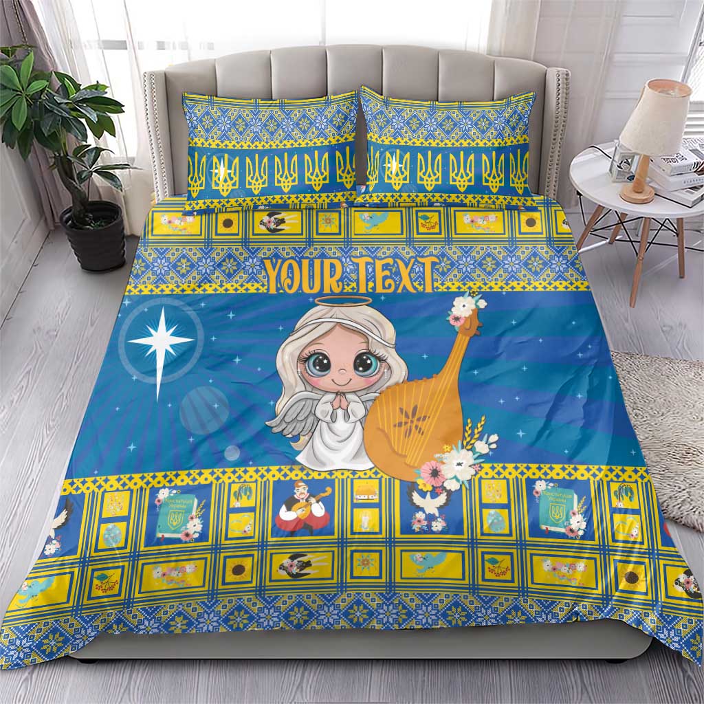 Blue duvet cover and pillow shams with angel figure, star sparkle, and yellow geometric trim