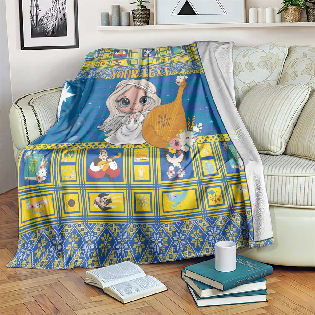 Blue Christmas blanket with cartoon angel, starry background, yellow grid accents