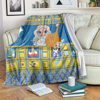 Blue Christmas blanket with cartoon angel, starry background, yellow grid accents