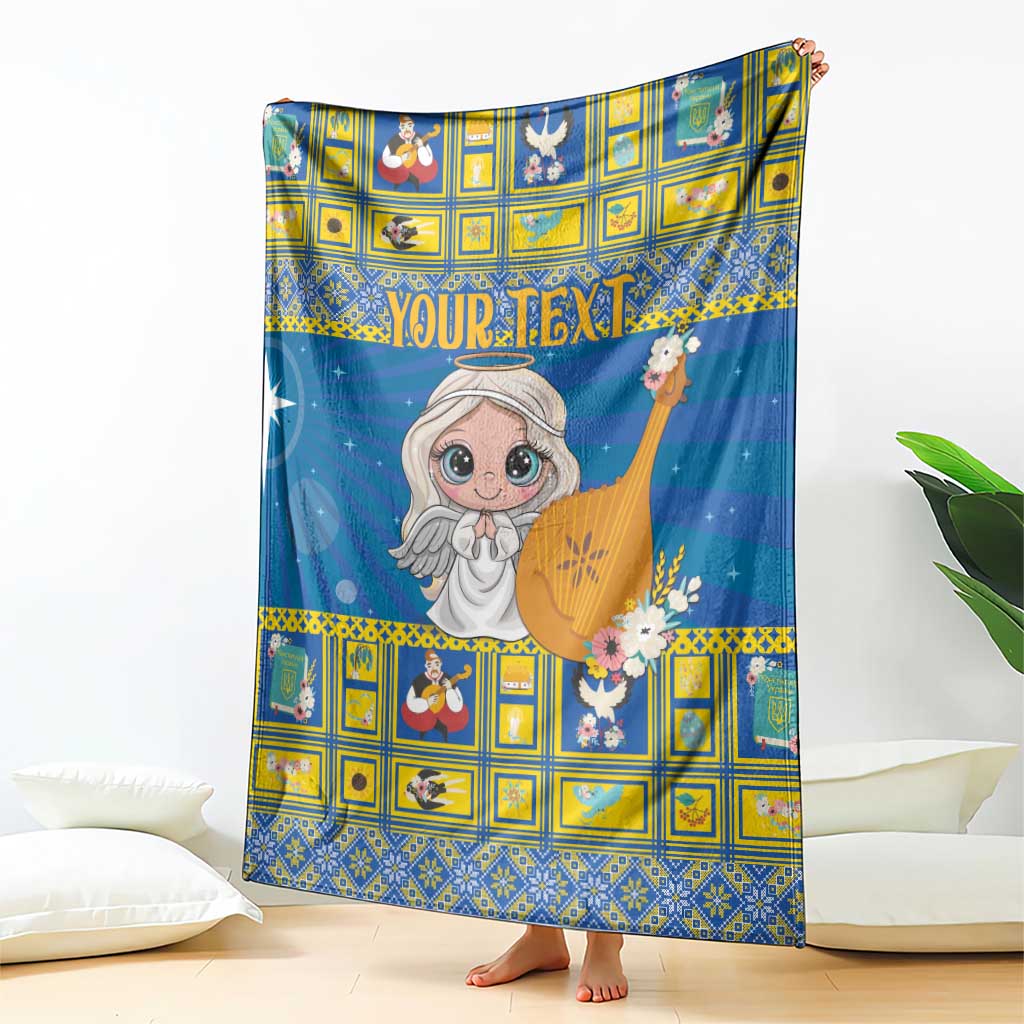 Blue and yellow Christmas blanket draped on couch with angel holding a nativity star