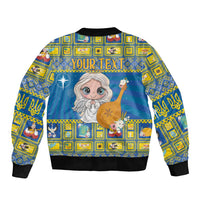 Unisex blue bomber jacket with angel holding harp, 'You're' text, black ribbed cuffs