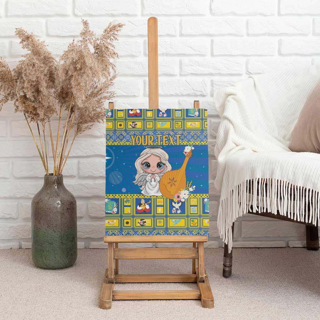 Personalized blue canvas wall art on wooden easel, angel holding harp with floral accents