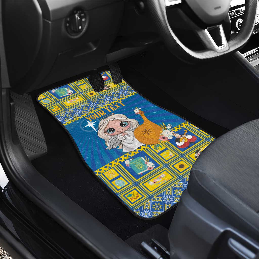 Blue front car mat with angel graphic and “YOUR TEXT” on a yellow patterned design