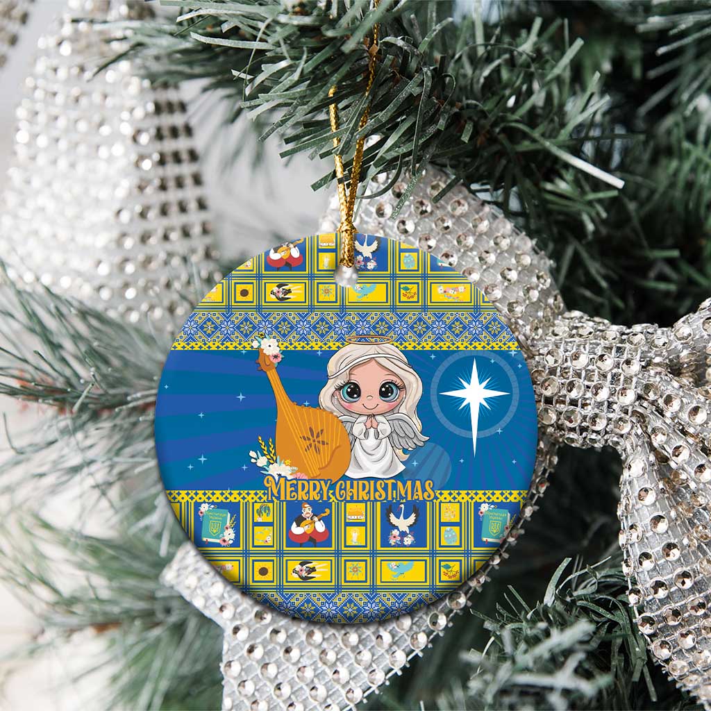 Blue ceramic Christmas ornament with angel artwork, round shape, hanging on a pine tree