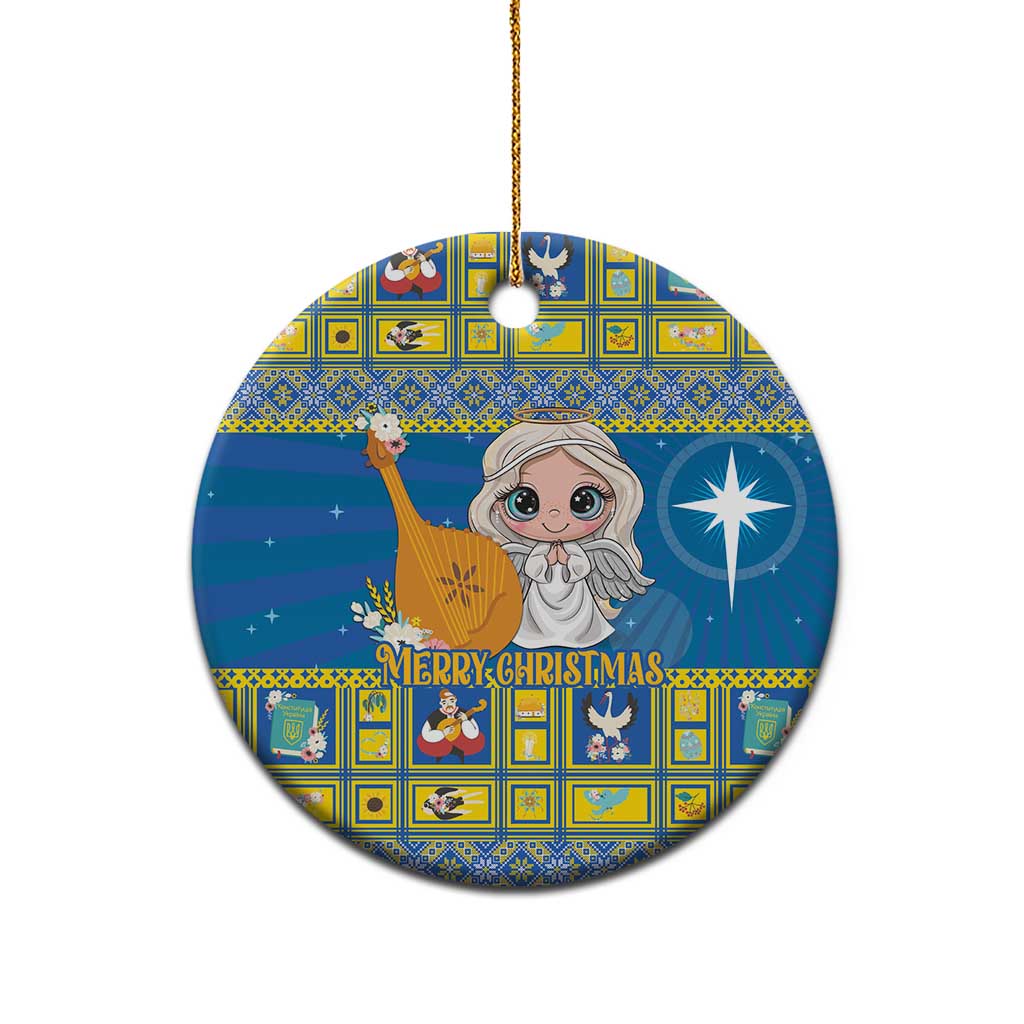 Blue ceramic Christmas ornament, round angel design with “Merry Christmas,” gold hanging loop