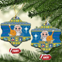 Blue ceramic Christmas ornament, snowflake shape with angel artwork, gold hanging loop and front/back tags